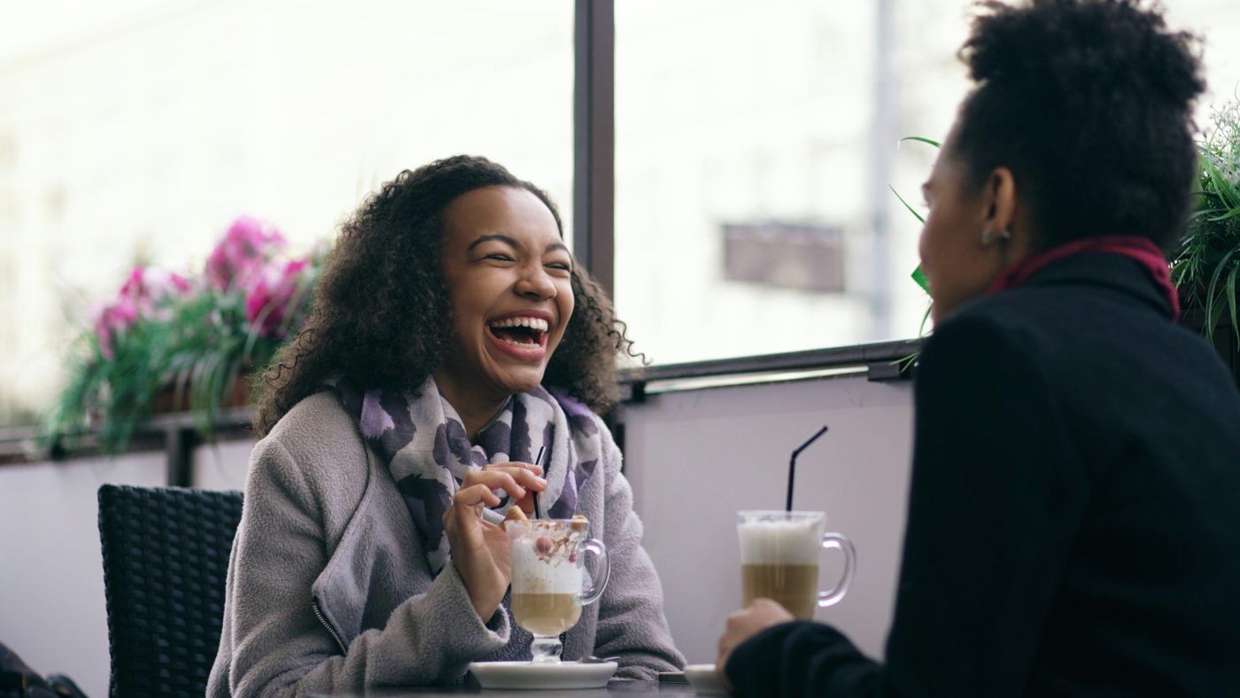 Two women talking over coffee